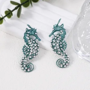 Teal vintage seahorse earrings with hollow mesh and crystal rhinestones in ocean style