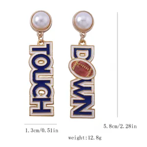 Detail view of American football earrings with Touch Down lettering and faux pearls