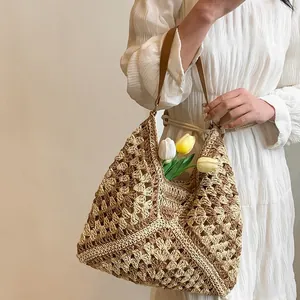 Handmade crochet straw tote bag with bohemian geometric hollow pattern and leather strap
