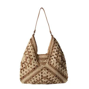 Bohemian crochet straw tote bag with geometric floral pattern and leather shoulder strap