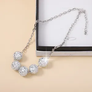Disco ball pendant necklace with five silver multi-faceted beads on a fine link chain
