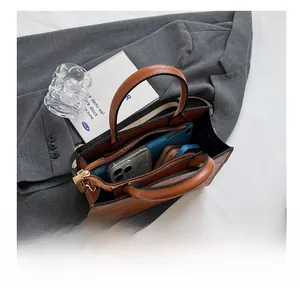 Top view of two-tone tote bag showing spacious internal compartments and quilted design