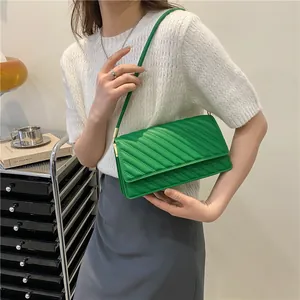 Chic quilted emerald green shoulder bag with diagonal patterns and gold-tone hardware