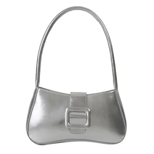 Silver metallic baguette underarm bag with a large decorative buckle and sleek finish