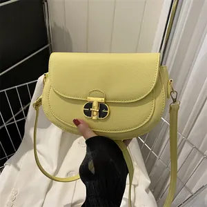 Chic light yellow leather saddle bag with gold metal buckle for women's crossbody wear