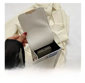 Interior view of white PU leather crossbody phone bag showing main pocket and card slot