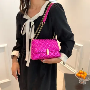 Quilted fuchsia shoulder bag with gold chain strap and metallic finish on crossbody bag
