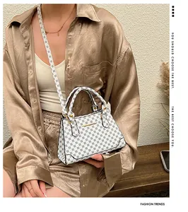 Chic retro monogram print handbag with golden hardware shown in an elegant lifestyle setting
