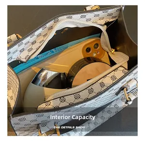 Internal capacity of white clover tote bag showing space for phone and makeup