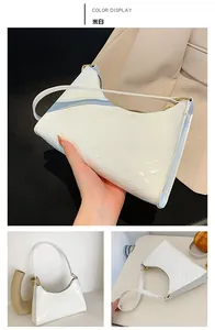 Macro detail of off-white glossy patent leather handbag with V-shaped quilted texture