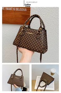 Macro detail of dark brown retro pattern bag with luxury gold hardware and leather strap