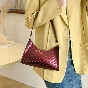 Glossy burgundy quilted faux leather shoulder bag with chic V-shaped stitching for women