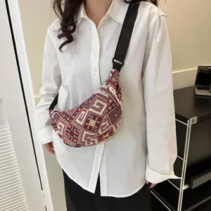 Vintage ethnic woven crossbody bag with geometric patterns and adjustable strap