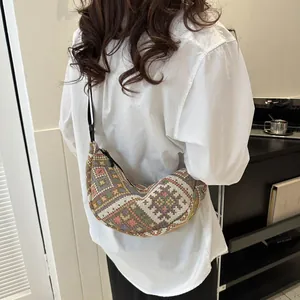 Ethnic bohemian woolen crescent crossbody bag with colorful geometric woven patterns