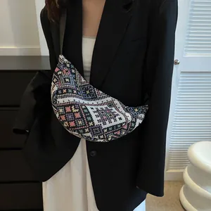 Retro ethnic style woven crescent crossbody bag with colorful geometric jacquard patterns