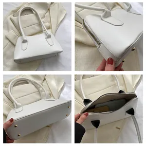 Vues détaillées d'un sac à main blanc en simili cuir avec clous dorés et intérieur
