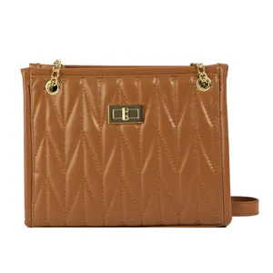 Brown quilted crossbody bag with gold chain strap and V-pattern stitching detail