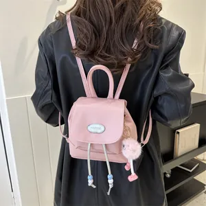 Pink vintage denim backpack for girls with bead drawstring and cute plush pendant