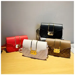 Macro detail of quilted leather shoulder bags with elegant gold metal buckles in four colors