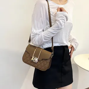 Quilted underarm square bag in brown PU leather with gold metal buckle and strap