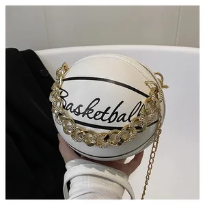 Detail of white basketball-shaped crossbody bag with gold chain and black text