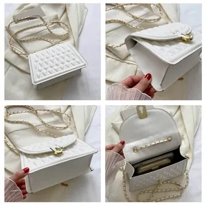 Detailed views of white quilted crossbody bag with gold chain strap and turn-lock closure