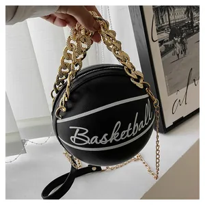 Detail view of black lychee leather basketball handbag with gold chunky chain handle