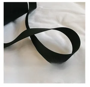 Close-up of durable black nylon shoulder strap with a premium woven texture finish