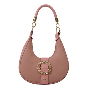 Chic pink crescent hobo bag with textured lychee leather and gold hardware ring