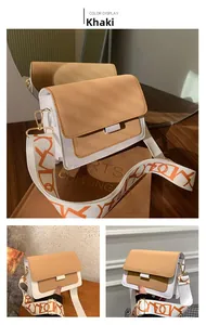 Detail of khaki PU leather crossbody bag featuring a wide geometric pattern strap