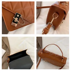 Détails du sac matelassé marron avec fermoir doré et bandoulière en chaîne métallique chic