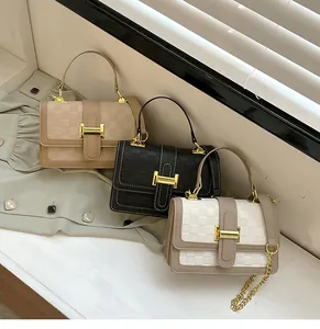 Three leather crossbody bags with embossed checkerboard pattern and gold hardware details