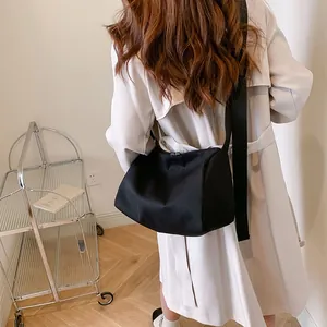 Black large capacity oxford tote bag with wide shoulder strap for commuting and daily use