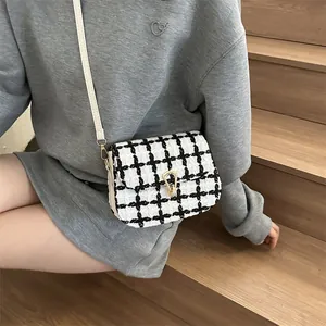 Fashionable black and white plaid crossbody bag with golden horseshoe lock for women