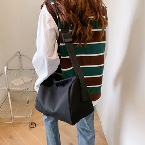 Large capacity black oxford fabric tote bag with adjustable wide strap for daily commute