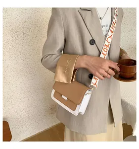 Chic khaki and white color-block crossbody bag with an ethnic-style printed wide strap