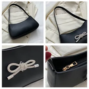 Detailed views of a black half-moon shoulder bag with a rhinestone bow and smooth zipper