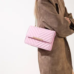 Pink quilted chain crossbody bag for women in elegant faux leather with gold finish