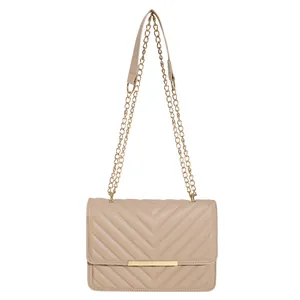 Minimalist beige quilted crossbody bag with gold chain strap and V-pattern faux leather