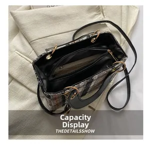 Internal view of tweed tote bag showing spacious capacity and gold hardware detail