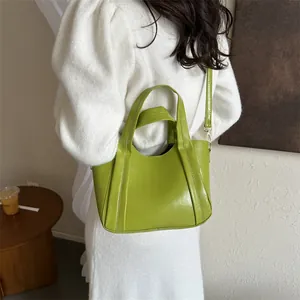 Fashionable large capacity bright green PU leather bucket bag with top handles for women