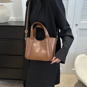 Chic brown minimalist large capacity bucket bag with glossy leather texture for women