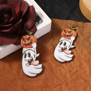Halloween wooden ghost and pumpkin drop earrings on a vintage floral background