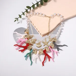 Hawaiian beach style layered necklace with pearls, starfish charms and colorful coral pendants