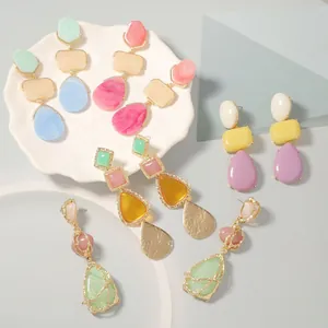 Collection of bohemian resin drop earrings in vibrant candy colors with alloy borders