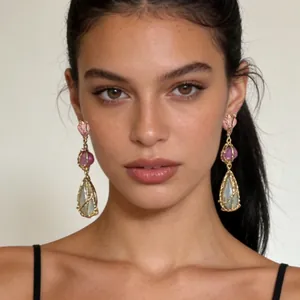 Bohemian dangle earrings with colorful resin stones and gold wire wrap on model