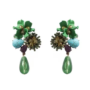 Detailed view of vintage bohemian resin flower and water drop earrings with rhinestones