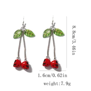 Detailed view of cherry skull earrings with length 8.8cm and width 1.6cm dimensions