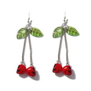 Gothic cherry skull long drop earrings with red skull pendants and green leaves