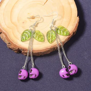 Creative Halloween cherry skull drop earrings with purple skulls and green leaves